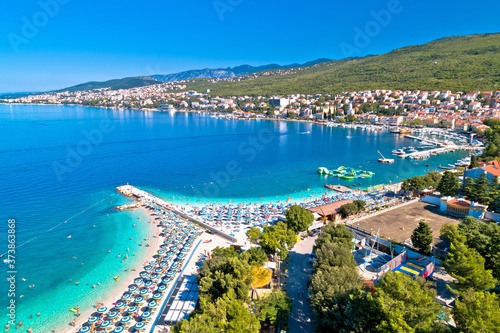 Tourist town of Selce and Poli Mora turquoise beach aerial view