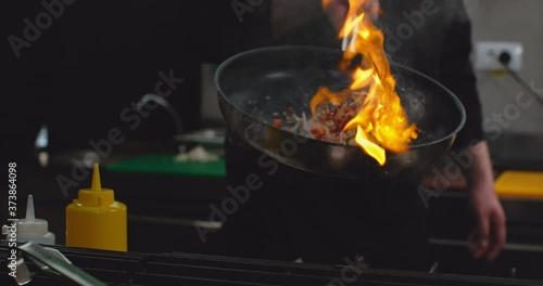 Pan Flame Fire Chef Cooking Food in Restaurant Big Flames in Slow Motion Close Up