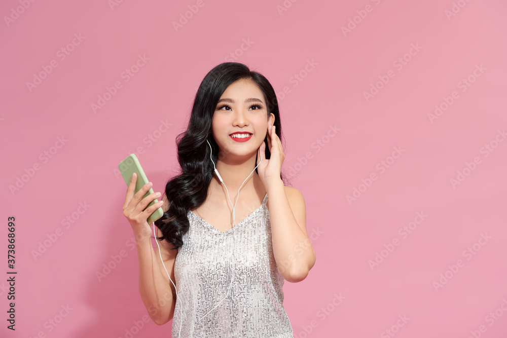 Beautiful girl with headphones on pink background Beautiful girl with headphones on pink background