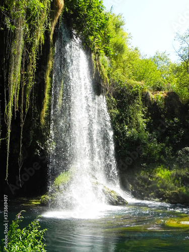 Nature landscape of waterfall in Antalya. Waterfall in mountain forest under the great sky. Adventures and travel concept. Scenic landscape. Beautiful place. Wild nature.