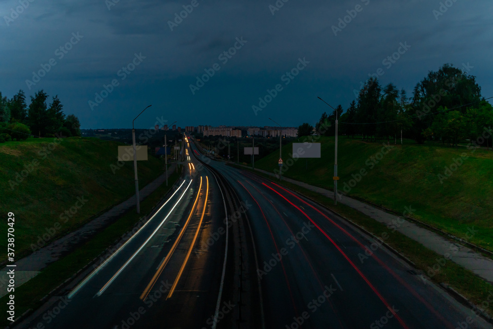 Long exposure of traffic on the street in the city during sunset. Long exposure of traffic on the street in the city during sunset.