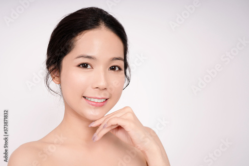 Beautiful Asian woman with clean face on white background