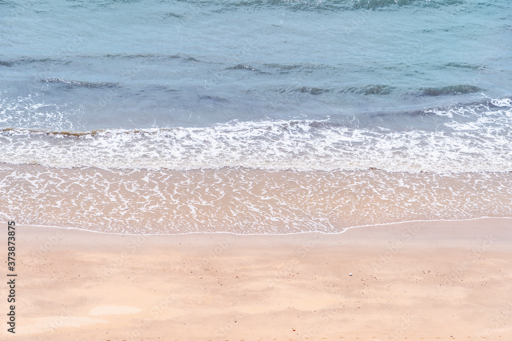 Close up ocean wave bubble on sandy beach. Background for vacation holiday and natural feeling. Close up ocean wave bubble on sandy beach. Background for vacation holiday and natural feeling.