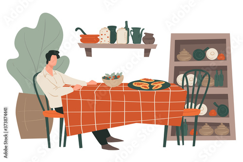 Man sitting by table at restaurant waiting for date