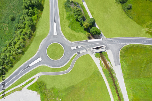 Bird's eye top view of the roundabout with three single-ended streets with green areas and bushes
