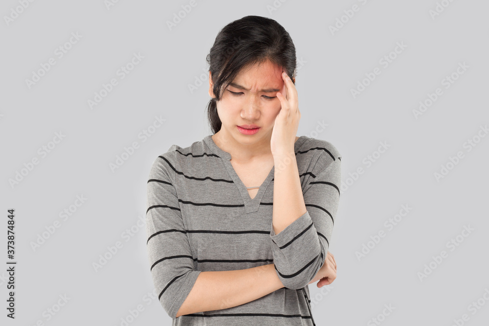young asian woman arms raised touch her head feel headache
young asian woman arms raised touch her head feel headache