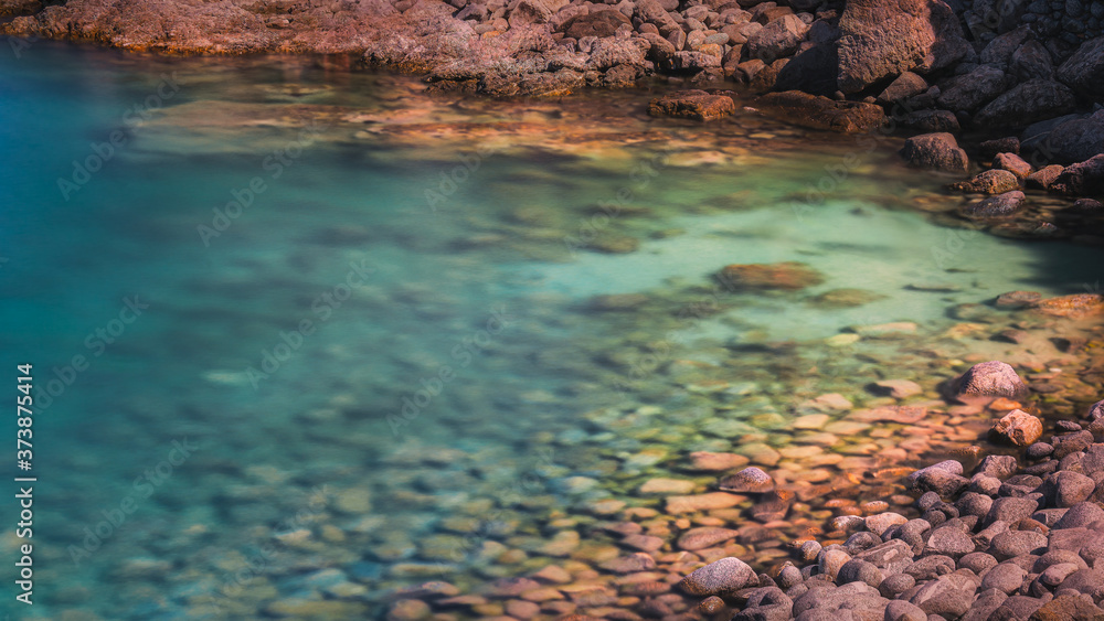 Green Sea Water And Rocks on italian coast