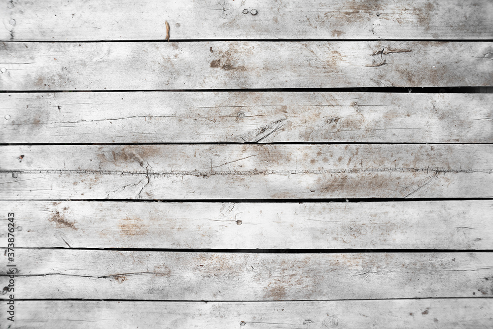 Fototapeta premium Old white wooden plank top view background.