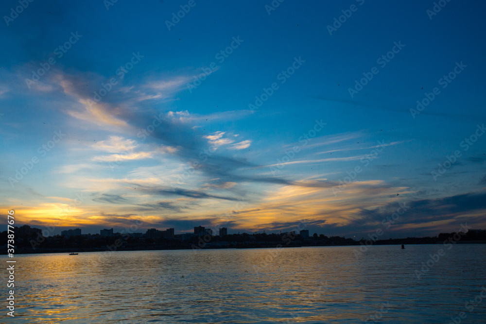 Naklejka premium sunset over the river
