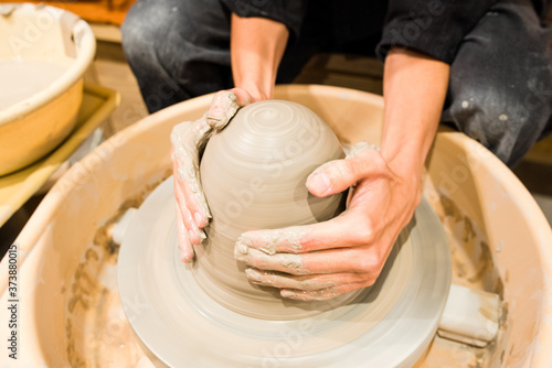 hands of a pottery work