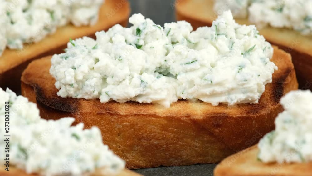 bruschetta with ricotta cheese and herbs rotating. Healthy appetizer, breakfast, snack bruschetta with ricotta cheese and herbs rotating. Healthy appetizer, breakfast, snack