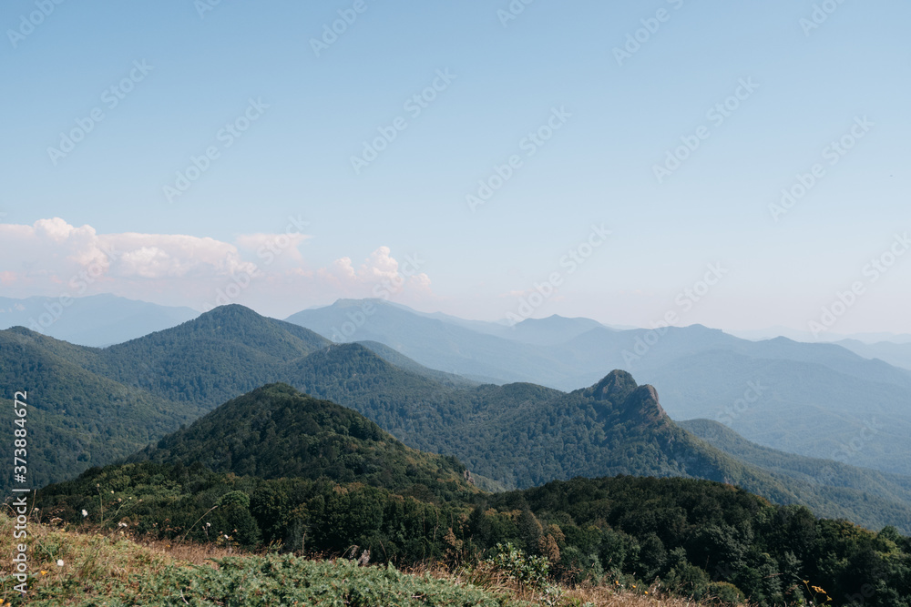 Panoramic view of the two-headed rocky mountain. Mountains and landscapes of the Caucasus nature reserve in Russia.