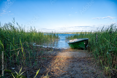 old wooden boat on the lake photo