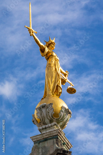 Lady Justice Statue at The Old Bailey in London, UK photo