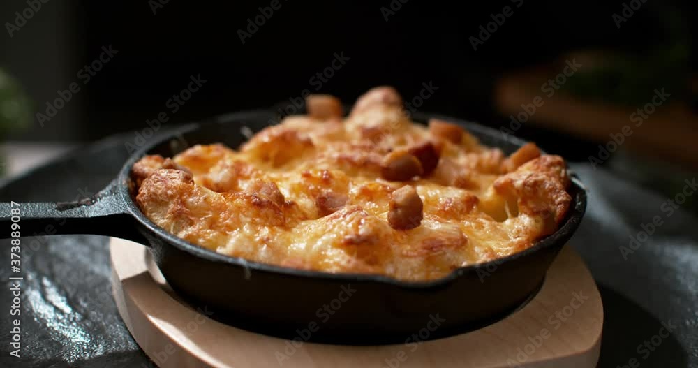 Rustic Food Crispy Cheese with Sausage Added Dropped in Pan Skillet Rotation Slow Motion Close Up Rustic Food Crispy Cheese with Sausage Added Dropped in Pan Skillet Rotation Slow Motion Close Up