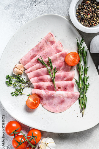 Sliced Pork ham. Fresh prosciutto.  White background. Top view
