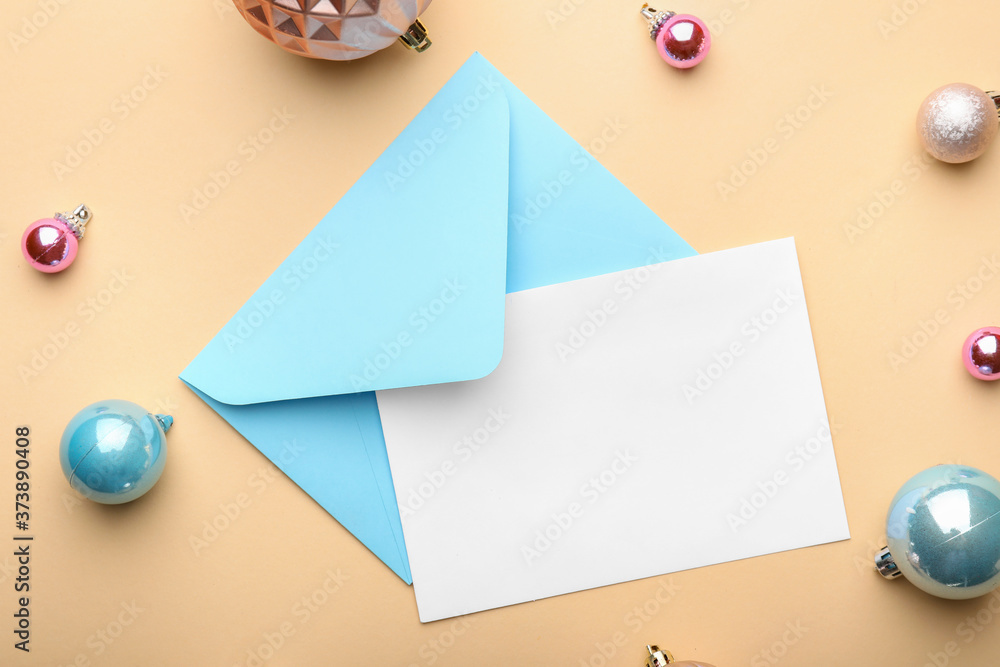 Christmas composition with blank card and envelope on color background Christmas composition with blank card and envelope on color background