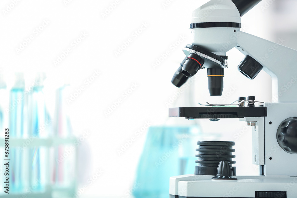 Modern microscope in scientific laboratory, closeup Modern microscope in scientific laboratory, closeup