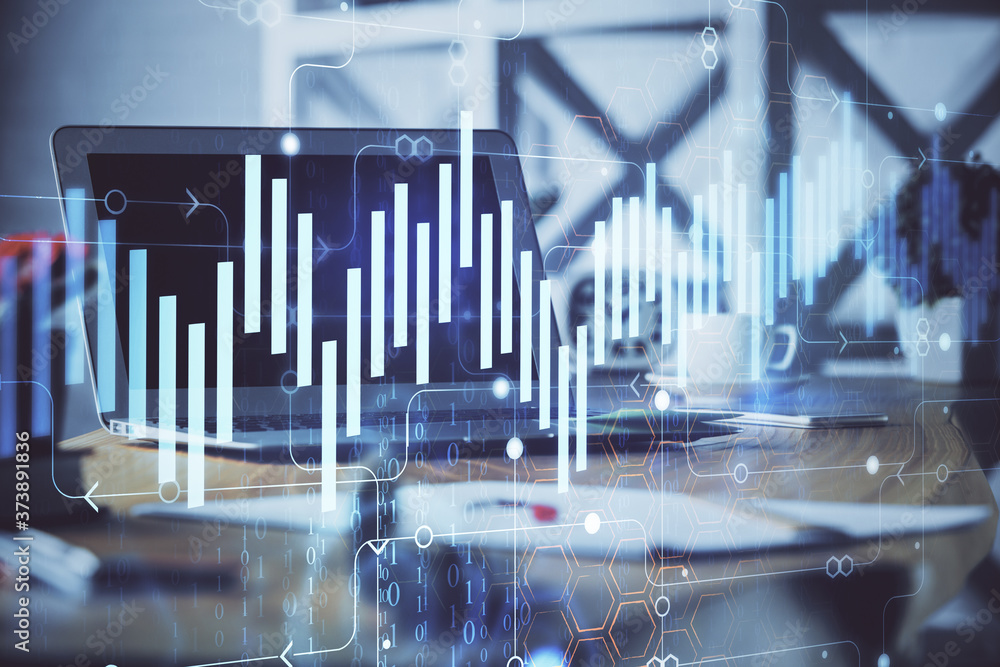 Forex market chart hologram and personal computer background. Multi exposure. Concept of investment. Forex market chart hologram and personal computer background. Multi exposure. Concept of investment.