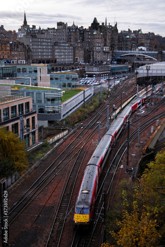train tracks with a train in city
