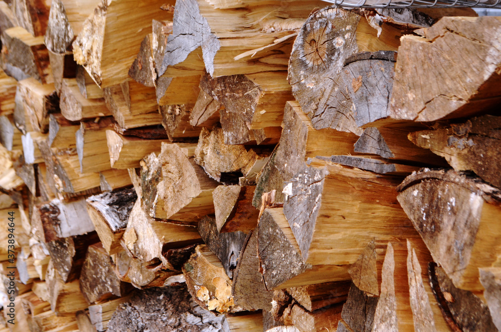Abstract photograph of piles of natural wooden logs. Background. Harvesting firewood for the winter. Texture. Wood for the fireplace. Birch boards. Macrosymka. Copy space. Abstract photograph of piles of natural wooden logs. Background. Harvesting firewood for the winter. Texture. Wood for the fireplace. Birch boards. Macrosymka. Copy space.