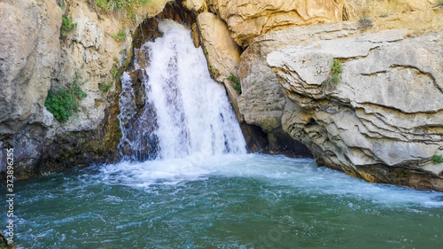 water flowing from the mountain, waterfall and natural landscape