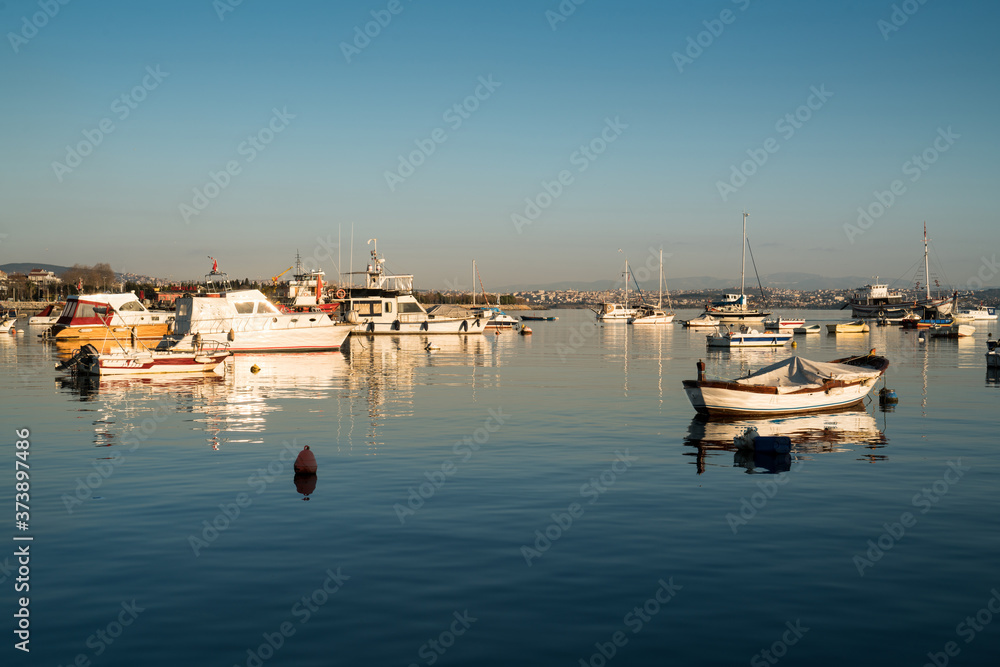 Boats in the sea at sunset. Tuzla, istanbul