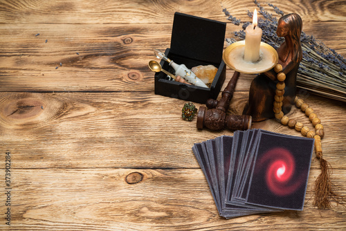 Schilderij op canvas Tarot cards on the old wooden table background.