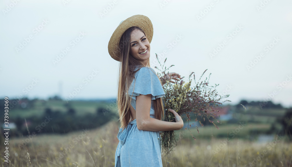 Young woman at the grassy field. Young woman enjoying summer 