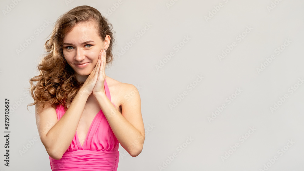Excited woman portrait. Ad background. Happy elegant lady in pink dress expecting opportunity isolated on light copy space. Fashion beauty. Holiday surprise. Excited woman portrait. Ad background. Happy elegant lady in pink dress expecting opportunity isolated on light copy space. Fashion beauty. Holiday surprise.
