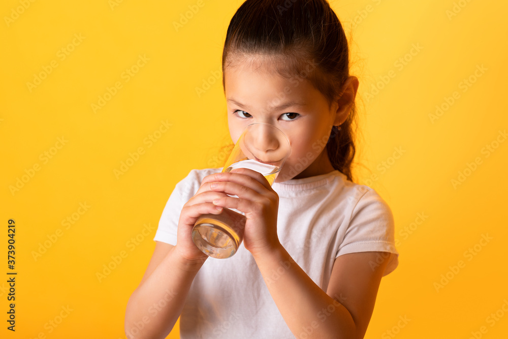 Portrait of asian child drinking fresh water Portrait of asian child drinking fresh water