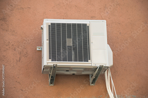 View of Cooling Fan Air Conditioner on stoned wall background