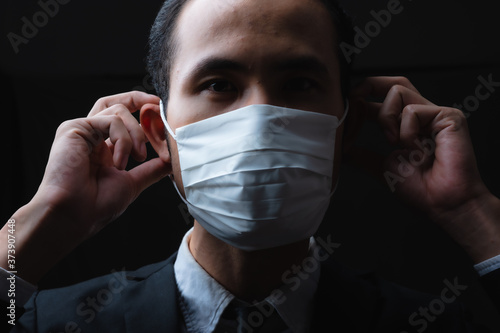 Businessman in suit wearing...