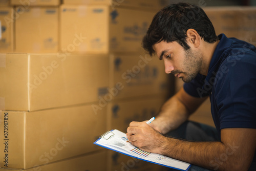 Male warehouse worker worki...