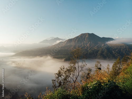 Batur volcano and Agung mountain from Kintamani, Bali, Indonesia in the morning mists