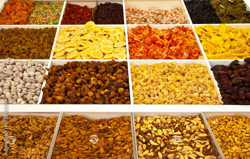 Nuts and dry fruits are sold at the market. Healthy, delicious organic foods. Edible background