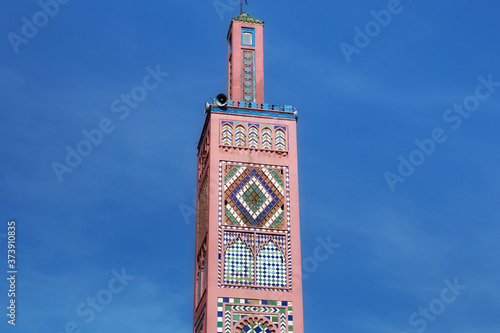 View of the minaret of Sidi Bou Abib Mosque in Tangier, Morocco. Is a mosque near Grand Socco medina area of central Tangier. It was built in 1917 and is decorated in polychrome tiles.