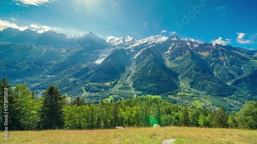 Wallpaper Mural 4K timelapse of snowy peaks of French Alps Mountains in Chamonix. Mont-Blanc landscape and Pine forest.Swiss rustic scene.Panoramic aerial view of the valley and the lovely town. Torontodigital.ca