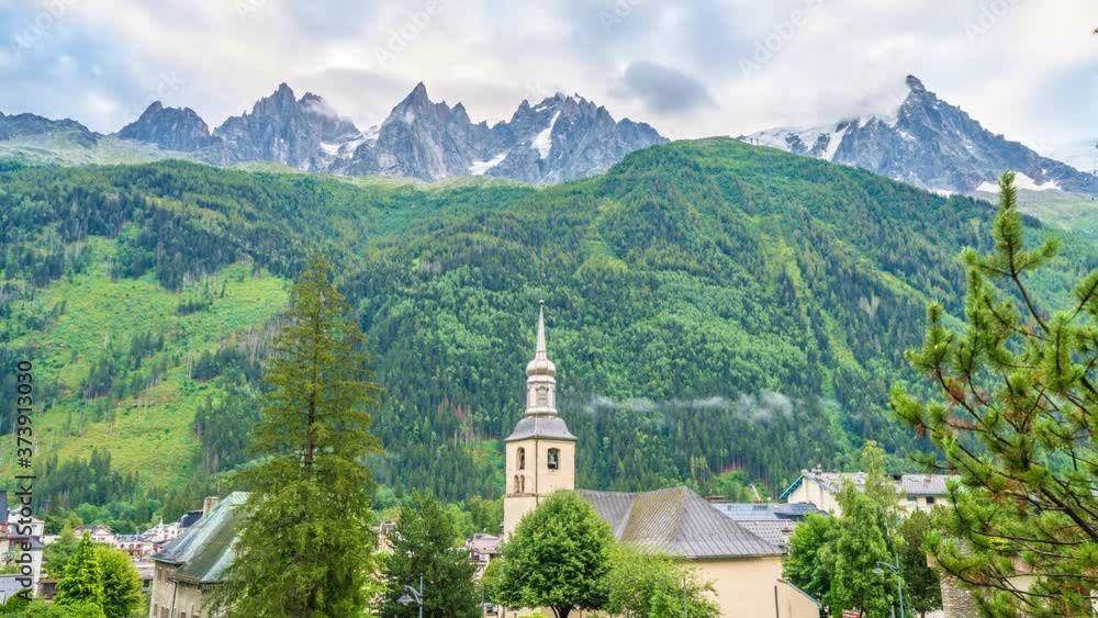 4K timelapse of snowy peaks of French Alps Mountains in Chamonix. Mont-Blanc landscape and Pine forest.Swiss rustic scene.Panoramic aerial view of the valley and the lovely town. 4K timelapse of snowy peaks of French Alps Mountains in Chamonix. Mont-Blanc landscape and Pine forest.Swiss rustic scene.Panoramic aerial view of the valley and the lovely town.