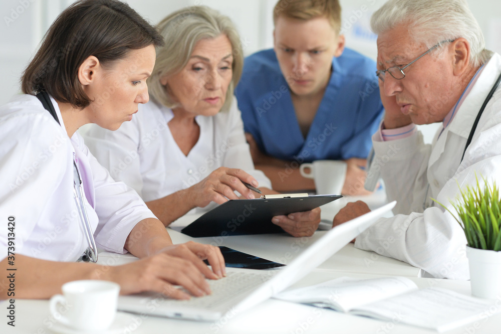 Close up portrait of professional doctors working in cabinet Close up portrait of professional doctors working in cabinet