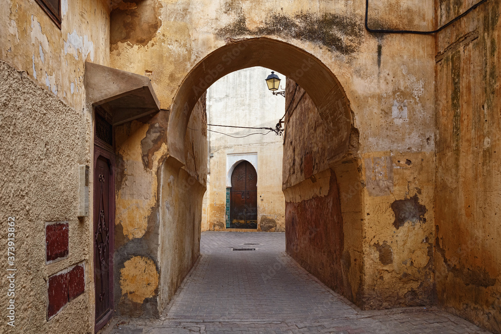 Old streets in Meknes medina. Meknes is one of the four Imperial cities of Morocco and the sixth largest city by population in the kingdom.