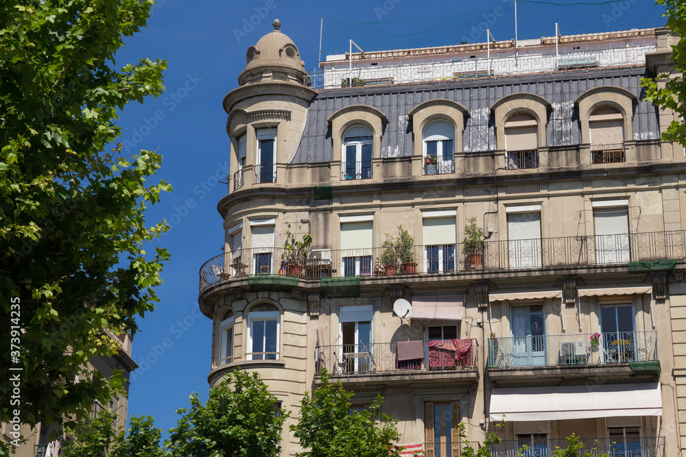 One of the old historical buildings in modern style in the center of Barcelona in sunny day. Spain.