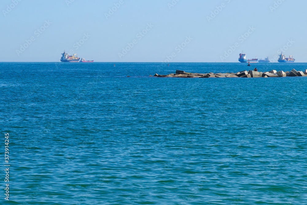 View of large commercial ships in the Mediterranean sea.
