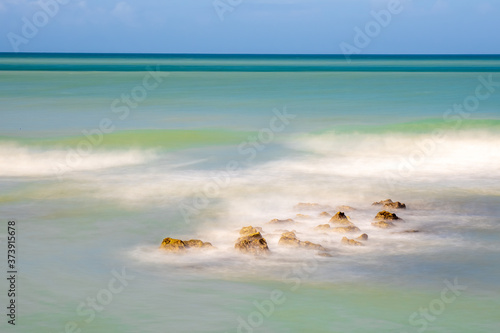 Long exposure to blur water of Gulf of Mexico at Caspersen Beach in Venice Florida USA photo