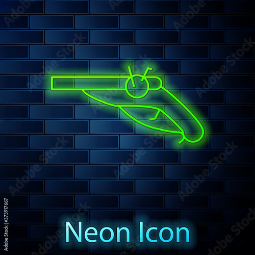 Glowing neon line Vintage pistols icon isolated on brick wall background. Ancient weapon. Vector.