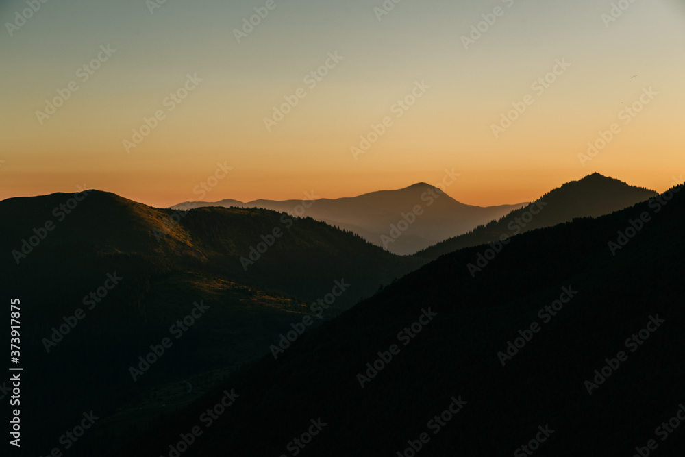 Fototapeta premium Amazing sunset in the wild ukrainian ridge Marmarosy, near Romania