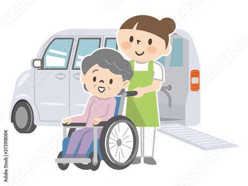 福祉車両と車椅子のシニア女性と介護スタッフ