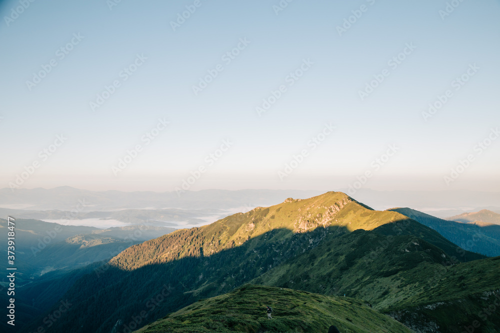 Obraz premium Amazing sunset in the wild ukrainian ridge Marmarosy, near Romania