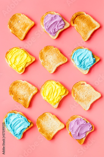 Pattern of toast bread with colored cheese spread. Layout top view © 9dreamstudio