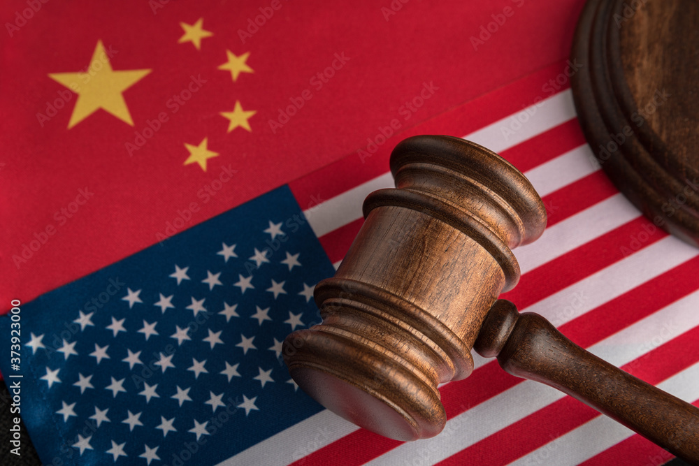 Judge gavel on the flag of the US and China. Trade war between China and the United States. Legal fight